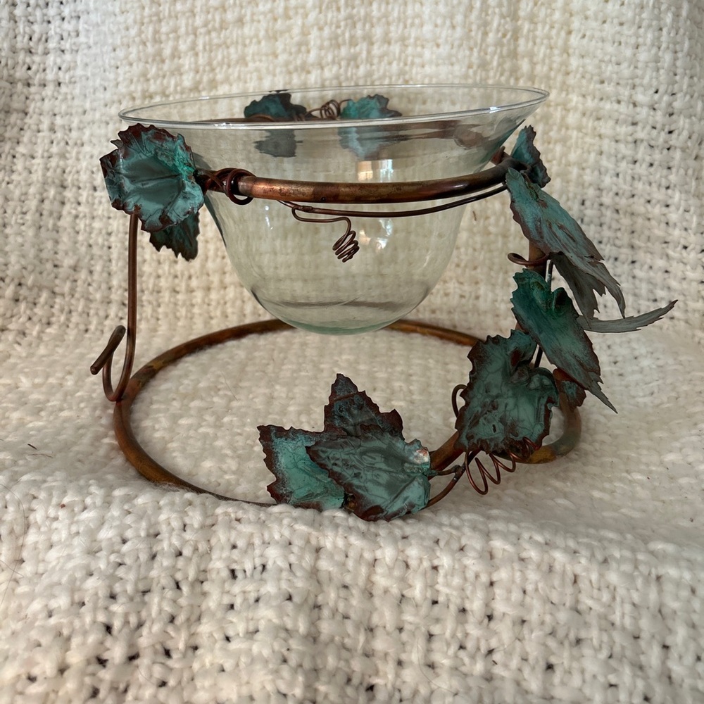 Vintage decorative clear bowl with copper stand.
